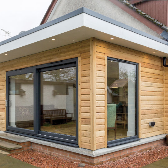 Garden room extension with Siberian Larch
